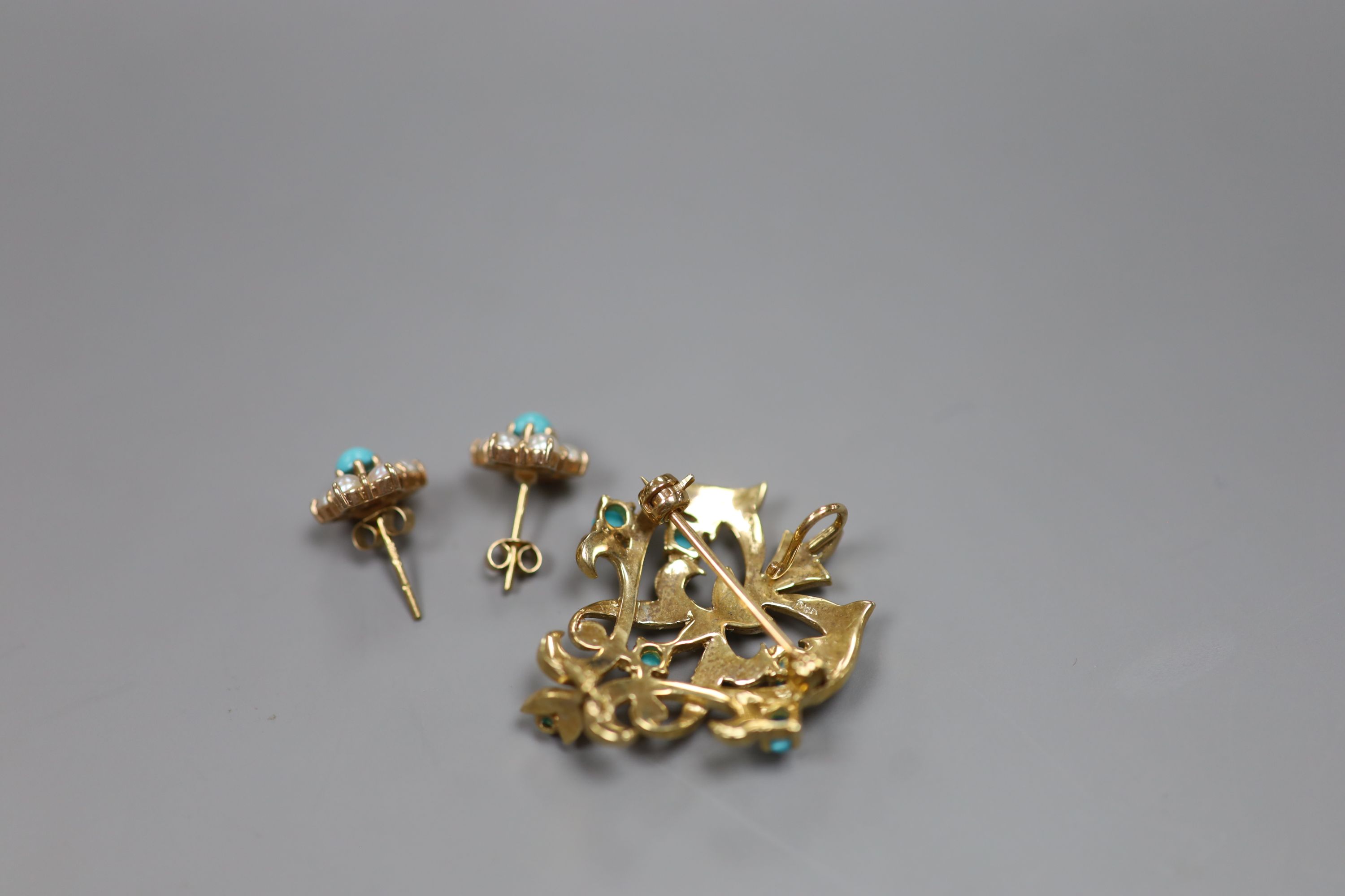 A modern 9ct gold, seed pearl and turquoise set scrolling pendant brooch, 34mm and a pair of matching ear studs